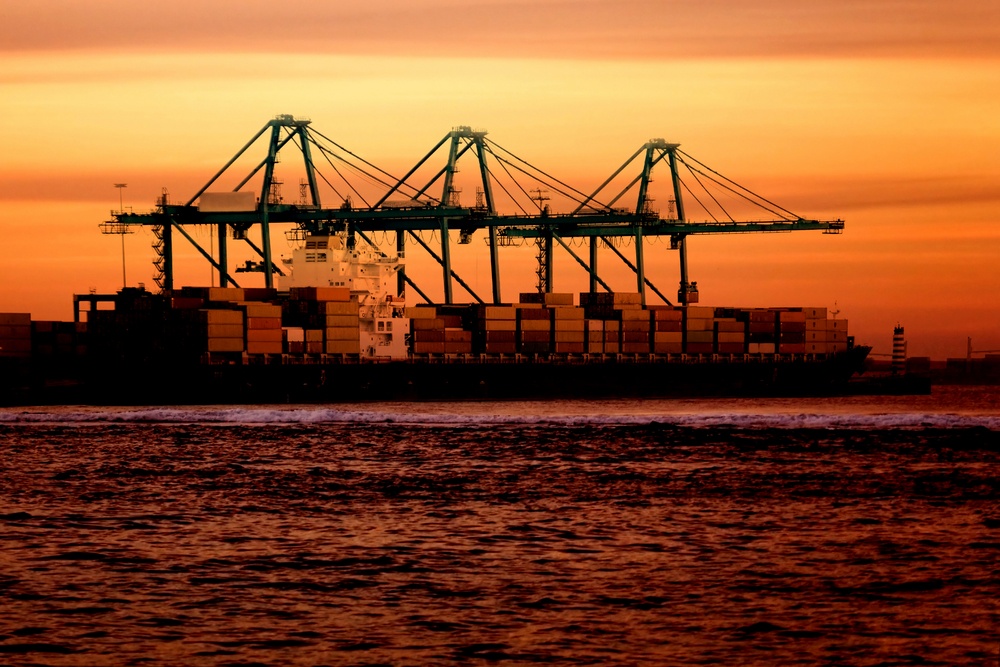 Cargo ship at sunset time in beautiful colours